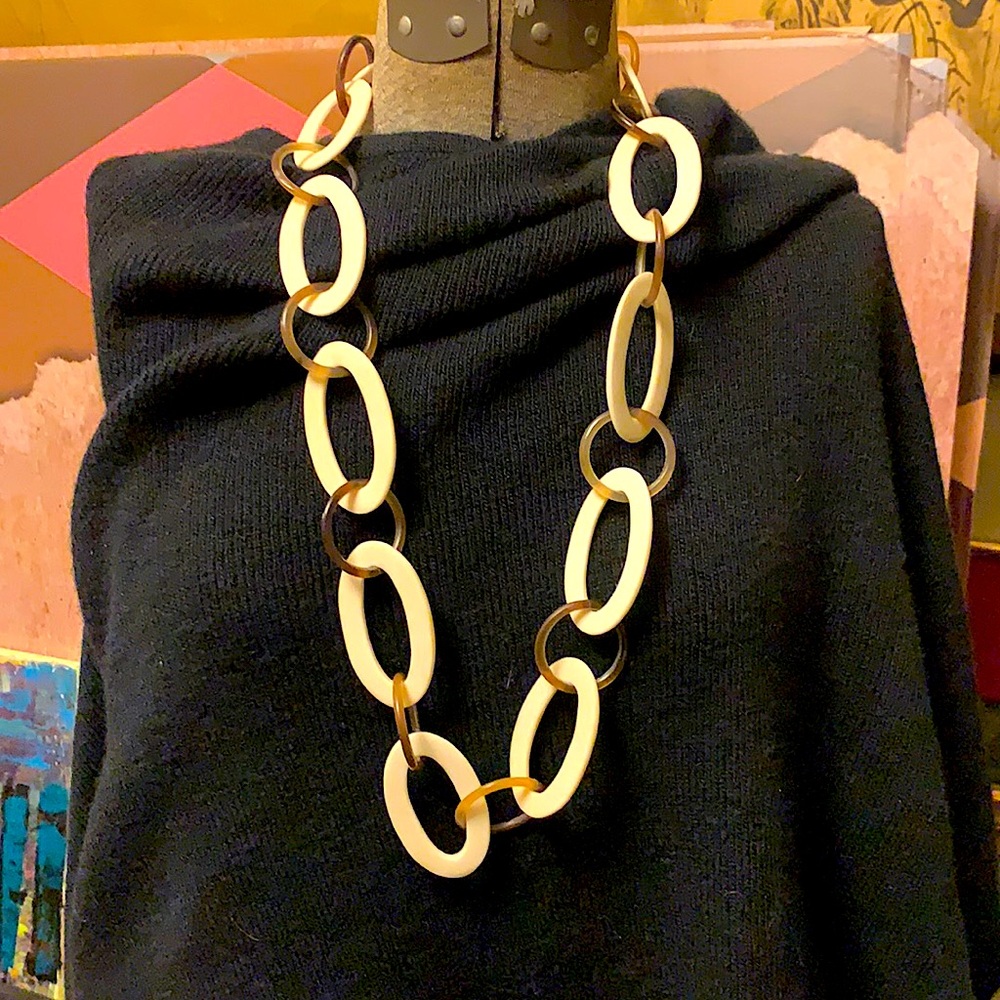 Oval rings of bone and amber lucite